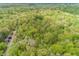 An aerial photograph of a house in the forest with a long dirt driveway at 1630 Hinson Rd, Martinsville, IN 46151