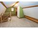 Lofted finished attic space with carpet and exposed beams at 1630 Hinson Rd, Martinsville, IN 46151