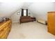 Cozy attic room with carpet flooring, dormer window, and neutral color scheme at 1630 Hinson Rd, Martinsville, IN 46151