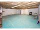 Spacious unfinished basement with painted floor, bare ceiling and a stove at 1630 Hinson Rd, Martinsville, IN 46151