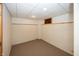 Clean, unfinished basement space with painted block walls and carpeting, ready for customization at 1630 Hinson Rd, Martinsville, IN 46151