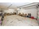 An empty and well lit garage with a white painted floor at 1630 Hinson Rd, Martinsville, IN 46151