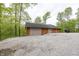 Exterior of a detached three car garage with an extended parking area at 1630 Hinson Rd, Martinsville, IN 46151