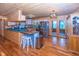 Modern kitchen features stainless steel appliances, wooden cabinets, and a breakfast bar at 1630 Hinson Rd, Martinsville, IN 46151