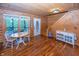 Cozy living room with hardwood floors, wood paneled walls, and natural light streaming through windows at 1630 Hinson Rd, Martinsville, IN 46151