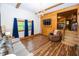 Cozy living room with hardwood floors, wood accent wall, and bright natural light at 1630 Hinson Rd, Martinsville, IN 46151