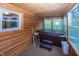 Sunroom featuring a hot tub, offering a relaxing retreat with wooded views at 1630 Hinson Rd, Martinsville, IN 46151