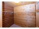 Walk-in closet with wood-paneled walls and shelving system, perfect for organization at 1630 Hinson Rd, Martinsville, IN 46151