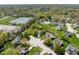 Aerial view of a neighborhood featuring manicured lawns, mature trees and nearby tennis courts at 18811 Orleans Ct, Noblesville, IN 46060