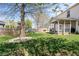 Expansive backyard features a screened porch, play set, lush lawn and mature trees creating a private outdoor oasis at 18811 Orleans Ct, Noblesville, IN 46060