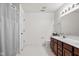 Clean bathroom with double sinks, a shower curtain, and tile flooring at 18811 Orleans Ct, Noblesville, IN 46060