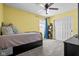 Well-lit bedroom features carpet, closet, and a ceiling fan at 18811 Orleans Ct, Noblesville, IN 46060