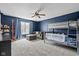 This bedroom has a bunkbed, gray sofa and a window at 18811 Orleans Ct, Noblesville, IN 46060