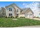 Charming two-story home with a two-car garage, manicured lawn and mature landscaping at 18811 Orleans Ct, Noblesville, IN 46060