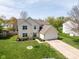 Charming two-story home with well-manicured lawn, mature landscaping, and a spacious driveway provides curb appeal at 18811 Orleans Ct, Noblesville, IN 46060