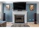 Elegant fireplace with a decorative mantle and wall-mounted TV, creating a focal point in the living area at 18811 Orleans Ct, Noblesville, IN 46060