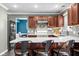 Bright eat-in kitchen featuring white countertops, a bar and wood cabinets at 18811 Orleans Ct, Noblesville, IN 46060