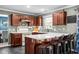 Well-appointed kitchen featuring granite countertops, and a breakfast bar with seating, perfect for casual dining at 18811 Orleans Ct, Noblesville, IN 46060