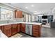 Modern kitchen with stainless steel appliances, white countertops, and a view into the open living area at 18811 Orleans Ct, Noblesville, IN 46060