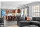 Open-concept living space with a kitchen featuring a breakfast bar and seamless connection to living area at 18811 Orleans Ct, Noblesville, IN 46060