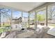 Staged screened in porch with outside view of backyard at 18811 Orleans Ct, Noblesville, IN 46060