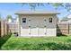 Practical backyard shed with double doors and windows providing extra storage space and organizational possibilities at 18811 Orleans Ct, Noblesville, IN 46060