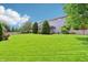 Large, green backyard with well-kept lawn and privacy fence, perfect for entertaining at 19248 Searay Dr, Noblesville, IN 46060