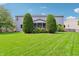 Expansive backyard with a well-manicured lawn, mature trees, and a view of the home at 19248 Searay Dr, Noblesville, IN 46060