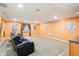 Basement featuring projector and screen, with comfortable seating and movie posters for the ultimate entertainment at 19248 Searay Dr, Noblesville, IN 46060