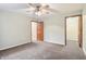 Bedroom featuring neutral walls, carpet, ceiling fan, with access to a walk-in closet at 19248 Searay Dr, Noblesville, IN 46060