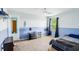 Two-tone bedroom with blue lower walls, ceiling fan, and a large window with black curtains at 19248 Searay Dr, Noblesville, IN 46060