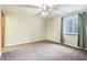 Bedroom with neutral walls, carpet, ceiling fan, and a window for natural light at 19248 Searay Dr, Noblesville, IN 46060