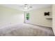 Spacious bedroom with neutral carpet, ceiling fan, and a view from the window at 19248 Searay Dr, Noblesville, IN 46060