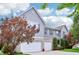 Well-maintained two-story home featuring gray siding, brick accents, and a spacious two-car garage at 19248 Searay Dr, Noblesville, IN 46060