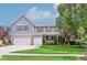 Charming two-story home with a manicured lawn, complemented by a two-car garage and gray siding at 19248 Searay Dr, Noblesville, IN 46060