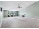 Large living room with vaulted ceiling, ceiling fan, and a large window that provides natural light at 19248 Searay Dr, Noblesville, IN 46060