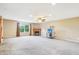 Large living room with carpet, a fireplace, and a window offering natural light at 19248 Searay Dr, Noblesville, IN 46060