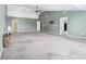Expansive living room boasting neutral-colored walls and carpet flooring and multiple entrances at 19248 Searay Dr, Noblesville, IN 46060
