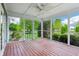 Cozy screened porch with wooden floors and ceiling fan, perfect for relaxing outdoors at 19248 Searay Dr, Noblesville, IN 46060