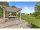 Beautiful backyard featuring a pergola-covered hot tub, patio area, and expansive green space, ideal for outdoor living at 19552 Wagon Trail Dr, Noblesville, IN 46060