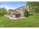 Picturesque backyard featuring a pergola-covered hot tub, well-maintained lawn, and mature trees, providing a private oasis at 19552 Wagon Trail Dr, Noblesville, IN 46060