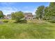 Expansive backyard with lush green lawn and mature trees creating a serene outdoor space at 19552 Wagon Trail Dr, Noblesville, IN 46060