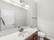 Cozy half bathroom with a stylish vanity, bright lighting, and updated fixtures at 19552 Wagon Trail Dr, Noblesville, IN 46060