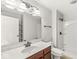Well-lit bathroom boasts a large mirror, vanity, toilet, shower, and neutral color scheme at 19552 Wagon Trail Dr, Noblesville, IN 46060