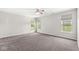 Spacious bedroom featuring three windows, neutral walls, and cozy carpeting at 19552 Wagon Trail Dr, Noblesville, IN 46060