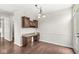 Dining area with wood floors, a built in desk and cabinets, and a doorway to a room at 19552 Wagon Trail Dr, Noblesville, IN 46060