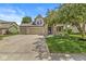 Inviting home with a three-car garage, stone details, covered porch, and lush green lawn, perfect for families at 19552 Wagon Trail Dr, Noblesville, IN 46060