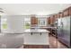 Beautiful kitchen features an island, granite countertops, stainless appliances, and wood cabinets at 19552 Wagon Trail Dr, Noblesville, IN 46060
