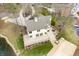 Aerial view of a home with a large deck, a patio, and a view of a lake at 2001 E Ely Ct, Martinsville, IN 46151