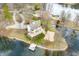 Stunning aerial view showcasing the home's waterfront location and private outdoor spaces including a pool at 2001 E Ely Ct, Martinsville, IN 46151